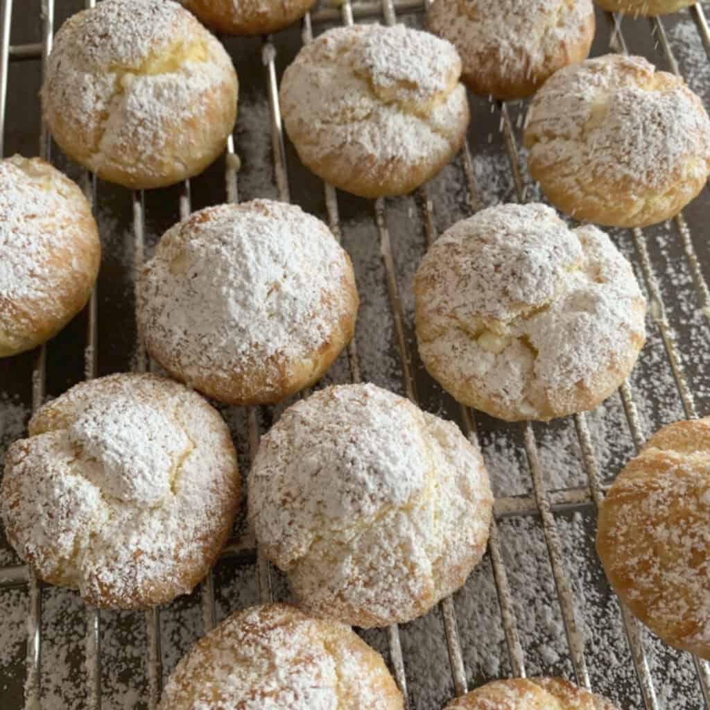 Powdered sugar-covered baked profiteroles..