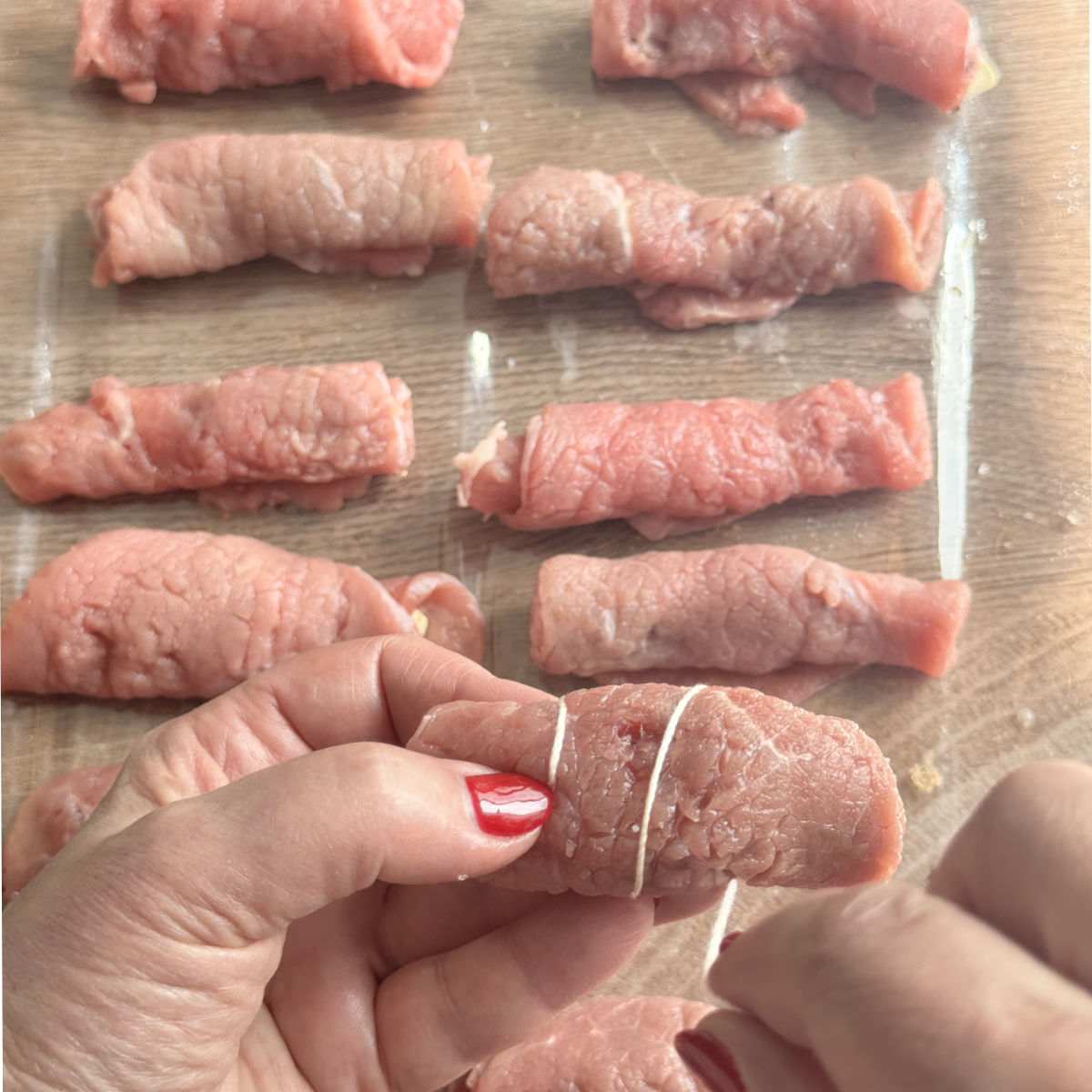 Process shots o making roasto, securing with a twine.