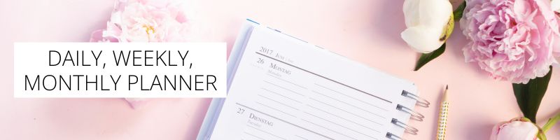 pretty flowers and weekly types of planners on a desk