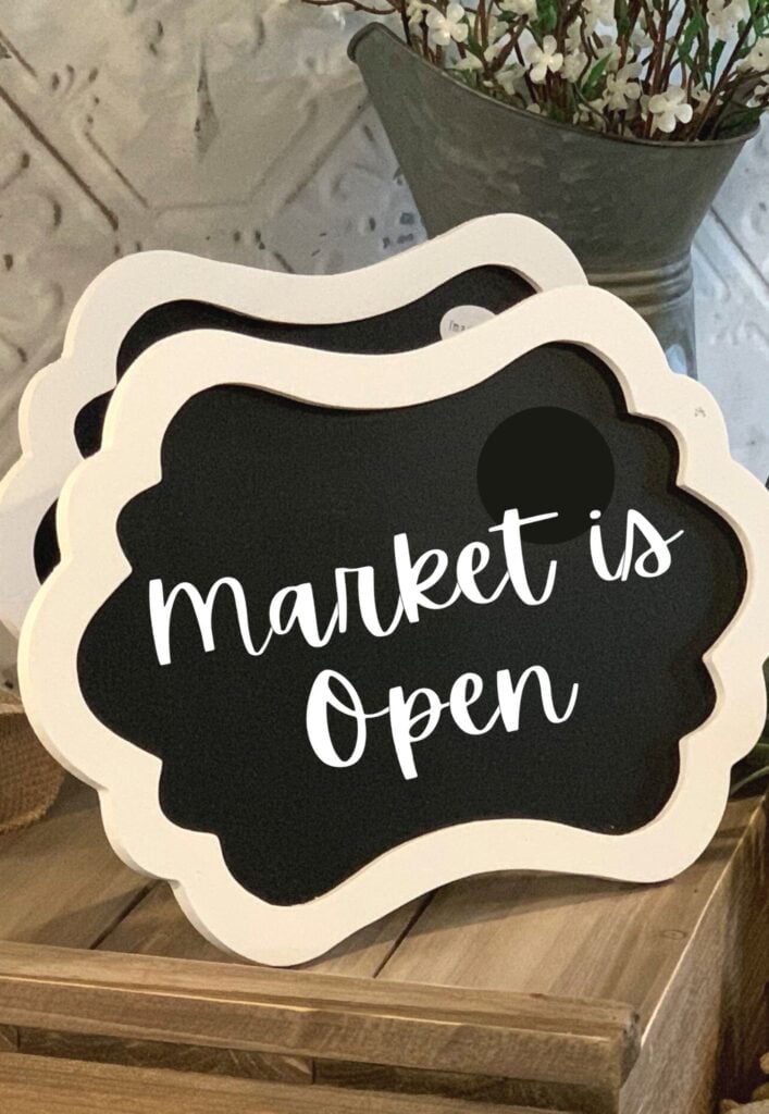 Market is open sign made with a Cricut for a garden themed baby shower
