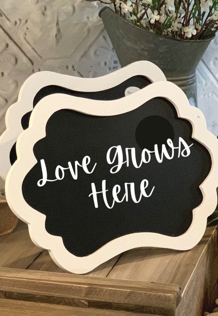 Love grows here sign for a garden themed baby shower