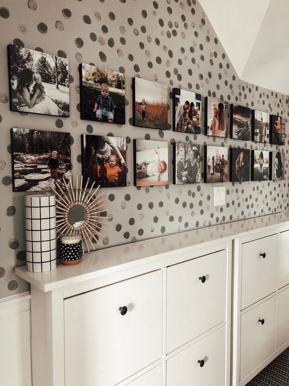 a Mixtiles arrangement along a built-in cabinet wall