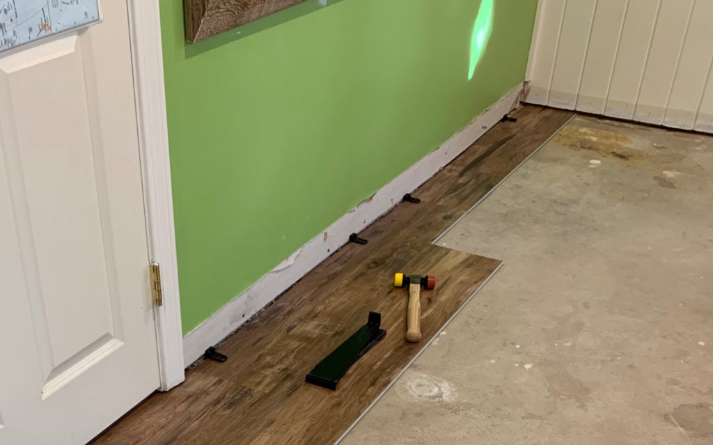 installing first row of vinyl plank flooring