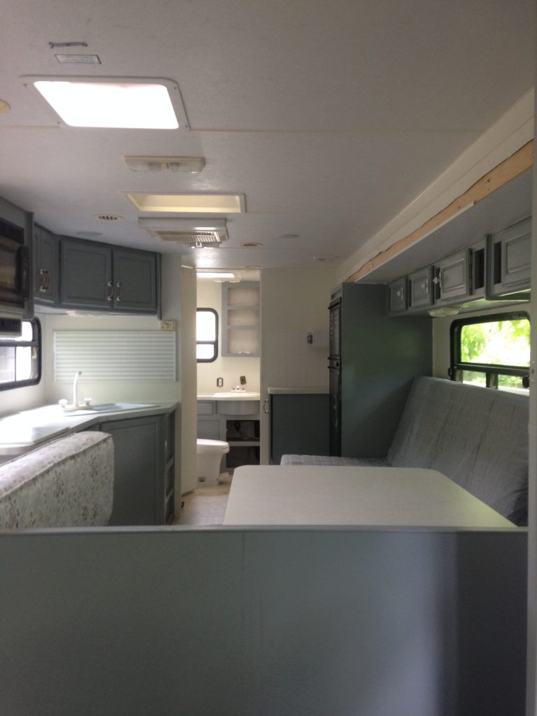 picture of our RV after painting the cabinets and walls. Camper remodel before and after