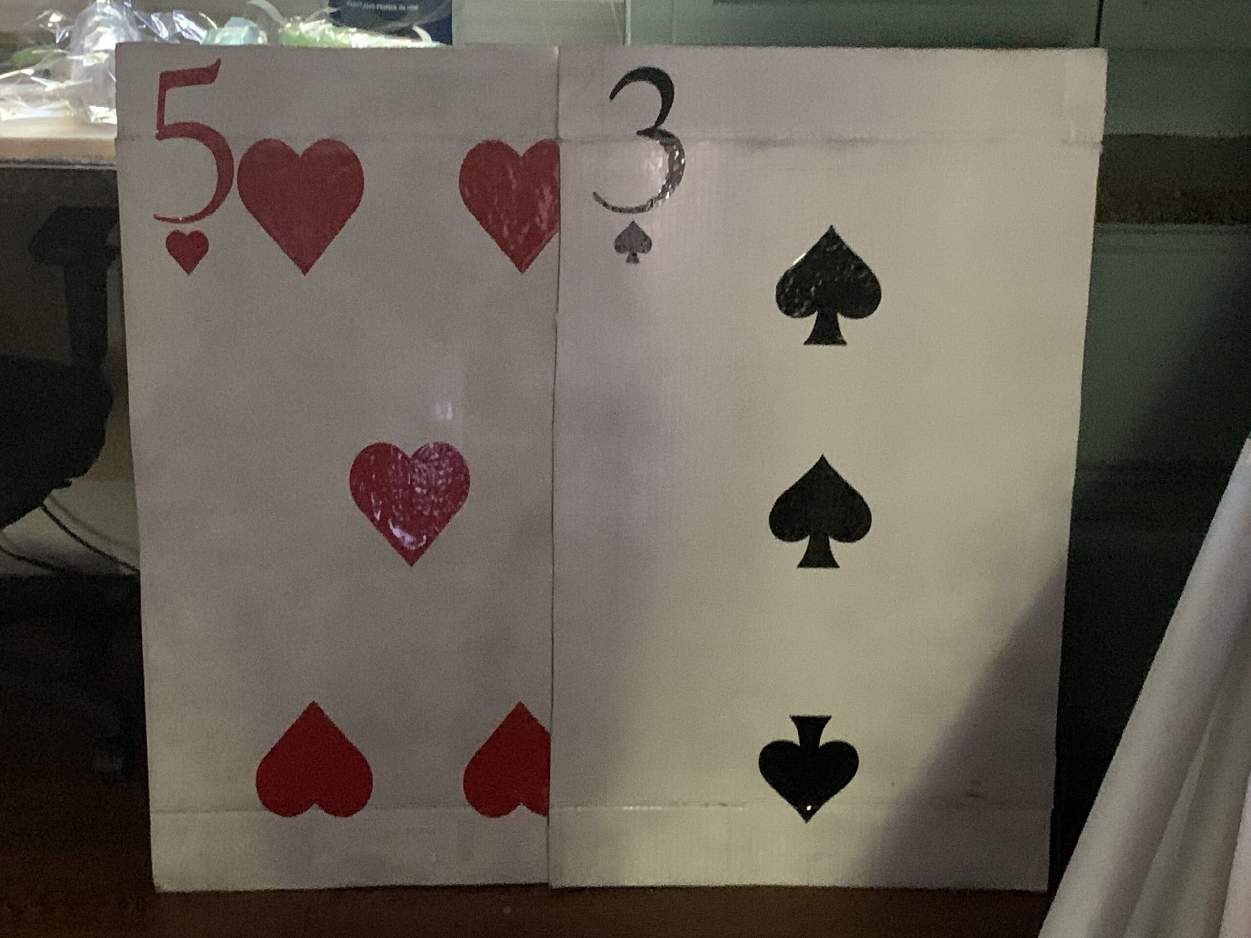 Large cardboard playing cards for a Toy Story theme party