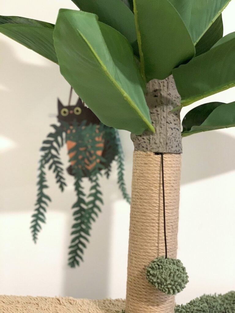 cat tree for cat room with cute decal on wall
