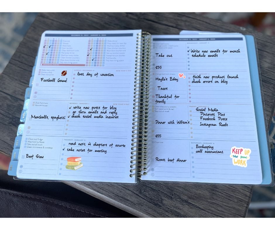 open paper planner book with examples of tasks