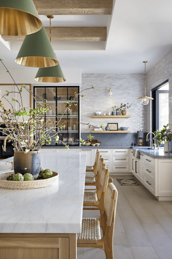 white kitchen with island lighting