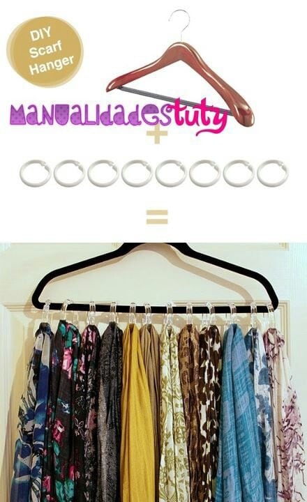 scarves hanging from shower curtain hooks on a clothes hanger