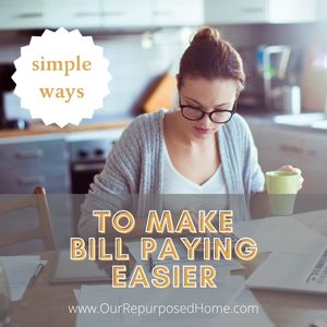 woman paying bills at the table