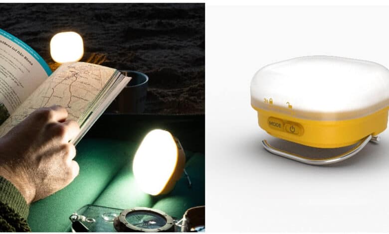 Camping gear including a map, flashlight, and a portable light source.