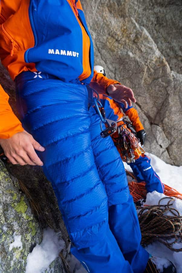 High-performance outdoor climbing gear in vibrant blue and orange, suitable for all weather conditions.