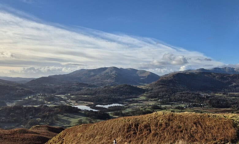 Panoramic view of rolling hills and mountains in a scenic outdoor landscape, ideal for hiking and exploring nature.