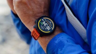 Close-up of a person wearing the Suunto Vertical 2 watch during outdoor activity.