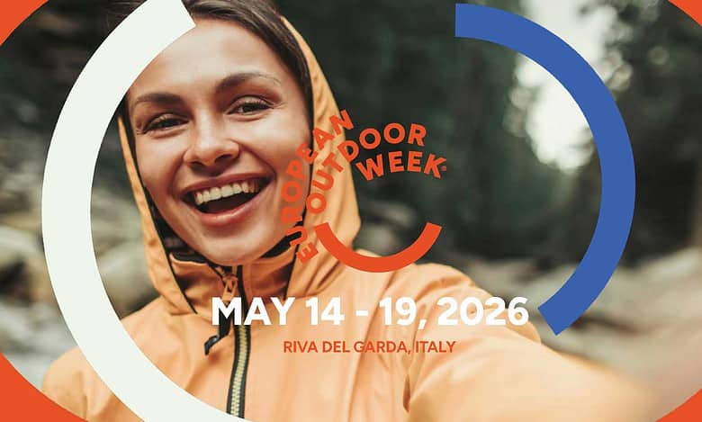 Smiling woman in outdoor gear at European Outdoor Week event.