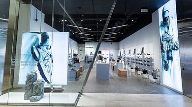 Salomon store interior showcasing outdoor footwear and apparel displays.