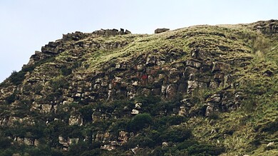Outdoor hikers exploring rugged mountain terrain.