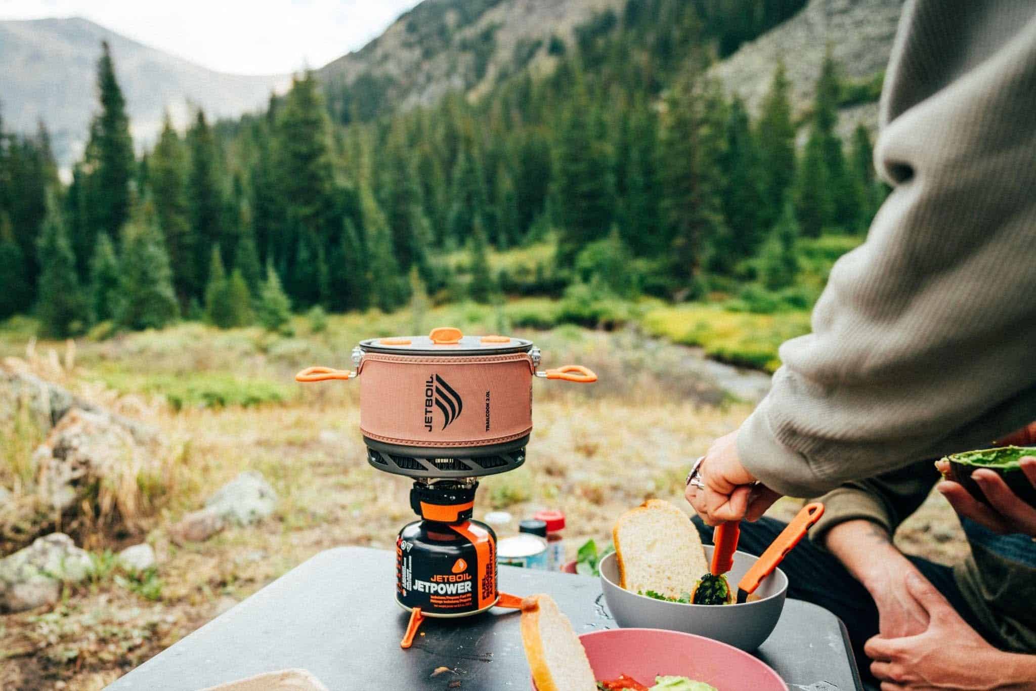 Outdoor Insight portable camping stove with compact design for outdoor cooking.