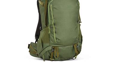 Green outdoor hiking backpack with multiple compartments and adjustable straps.