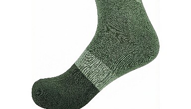 Green and black outdoor hiking sock with moisture-wicking fabric.