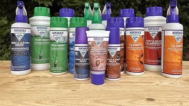 Collection of Nikwax cleaning products for outdoor gear and clothing.