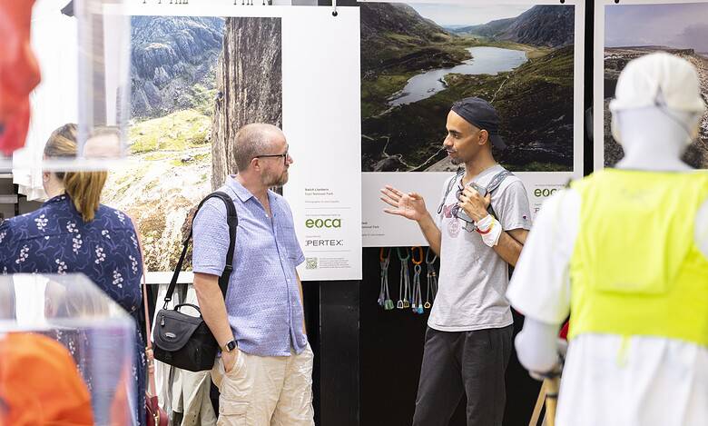 Outdoor Insight booth at an event showcasing nature photography and conservation efforts.