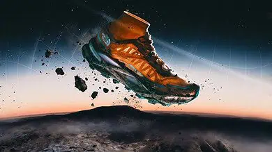 High-tech outdoor trail running shoe soaring above Earth at sunset.