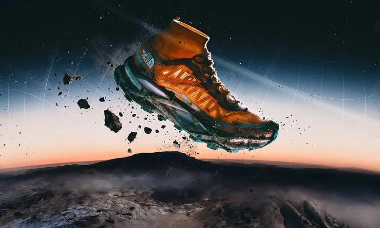 High-tech outdoor trail running shoe soaring above Earth at sunset.