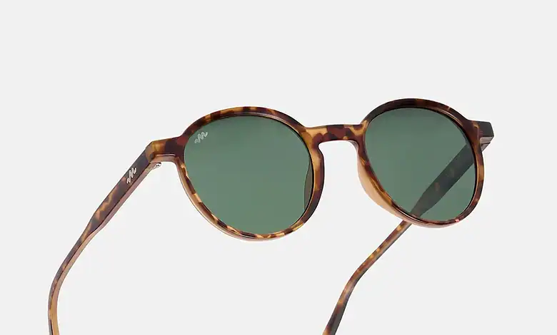 Tortoise brown sunglasses with green lenses for outdoor activities.