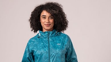 Women wearing a blue waterproof jacket for outdoor activities.