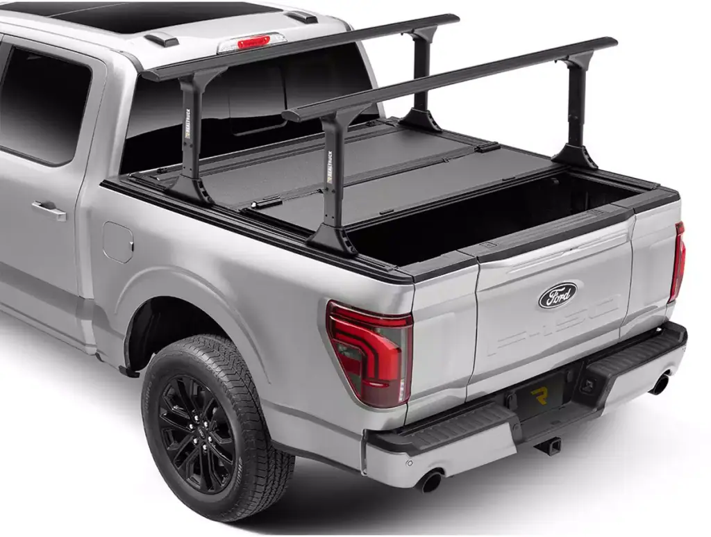 Ford pickup truck with bed racks and bumper guard for enhanced cargo and safety.