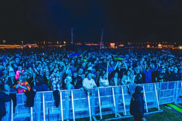 Crowd at Ibiza Orchestra Experience concert at night.