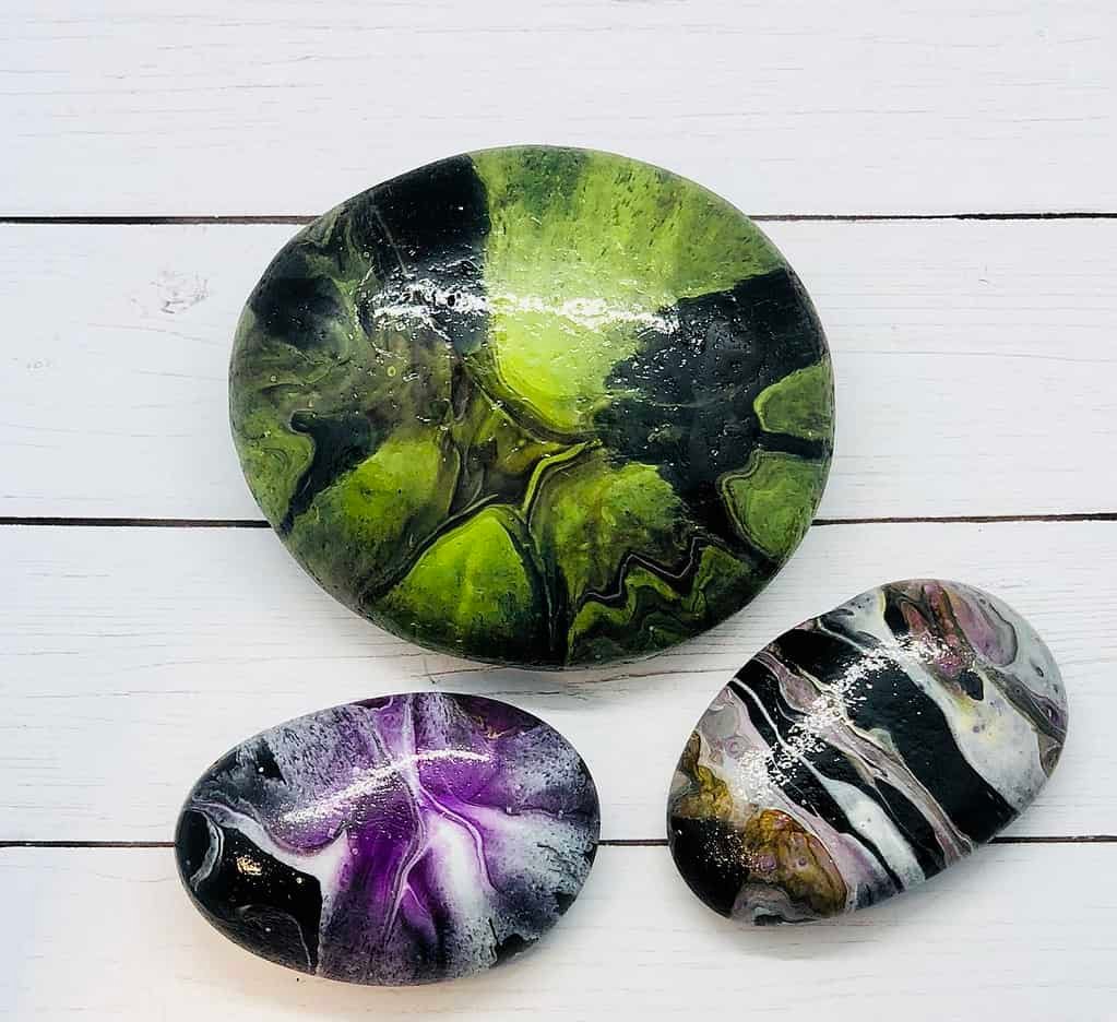 Try this Spooky Halloween Paint Pouring on Rocks Activity 5 halloween paint pouring on rocks