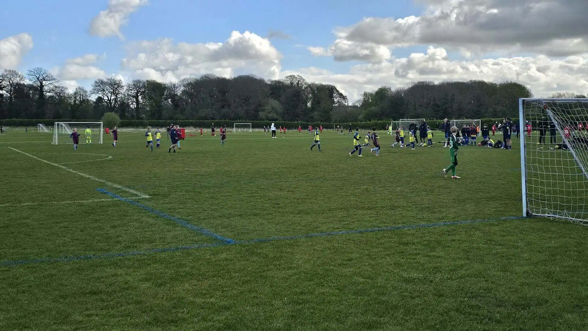 Sandbach United football team playing on a well-maintained grass field.