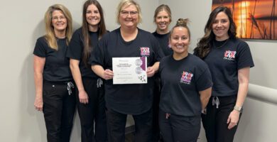 The Smith County Memorial Hospital Wound Clinic team pose together with their patient satisfaction award.