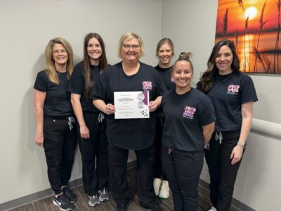 The Smith County Memorial Hospital Wound Clinic team pose together with their patient satisfaction award. 