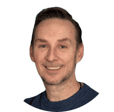 A smiling man with short dark hair and a blue shirt, professional headshot for Screendragon website.