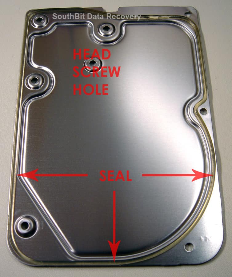 Inside of a hard drive top cover showing the rubber gasket seal