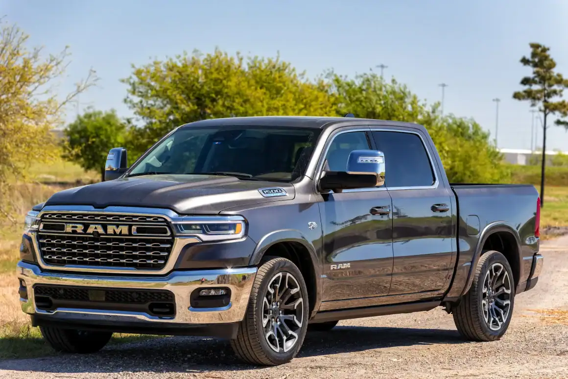 Ram 1500 Limited Longhorn pickup truck with V8 engine on a sunny day.