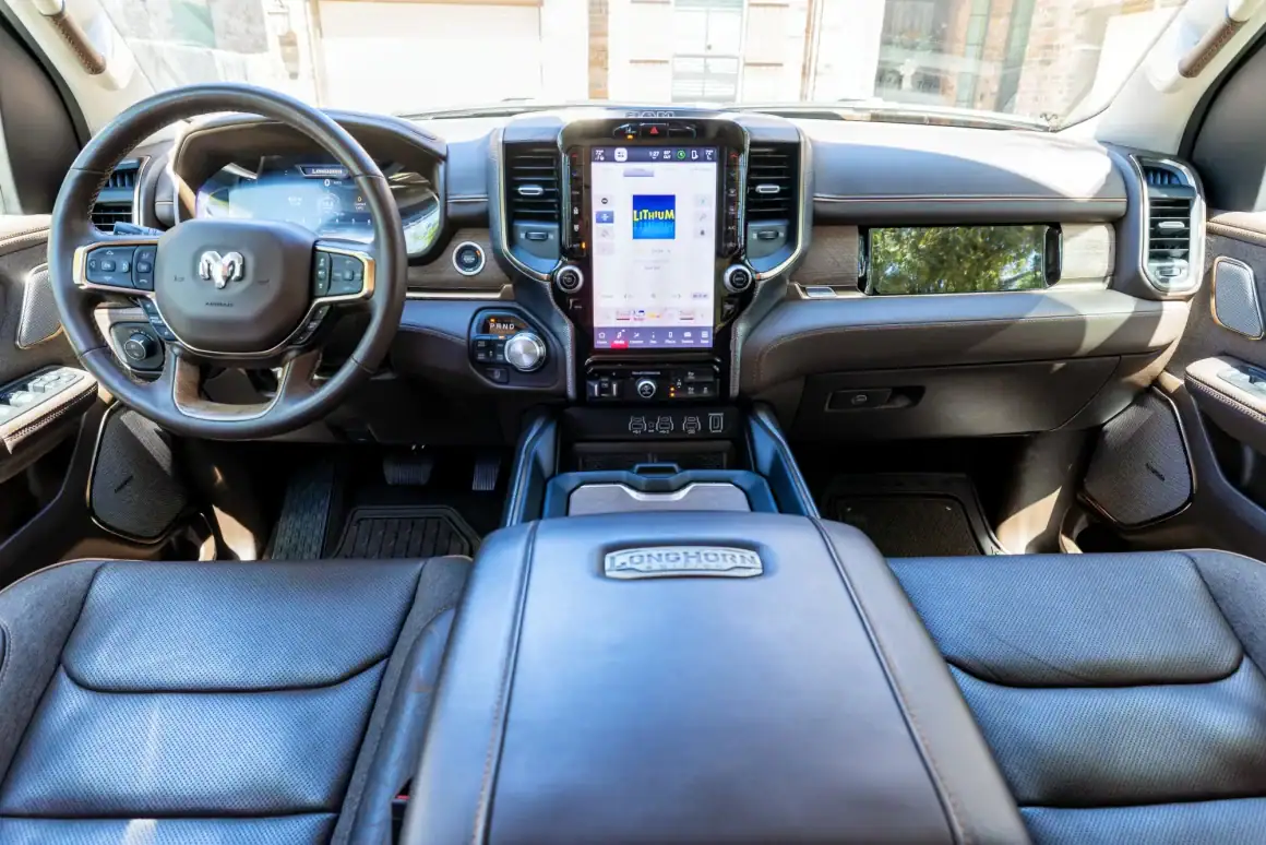 Interior dashboard of a modern RAM truck with advanced touchscreen controls.