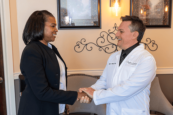 Dr. Chavez shaking hands with a new patient