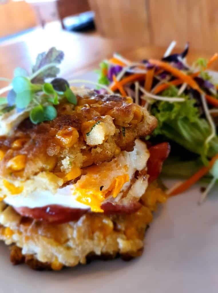 Crispy corn and bean topped burger with side salad at Stumble Inn NZ.