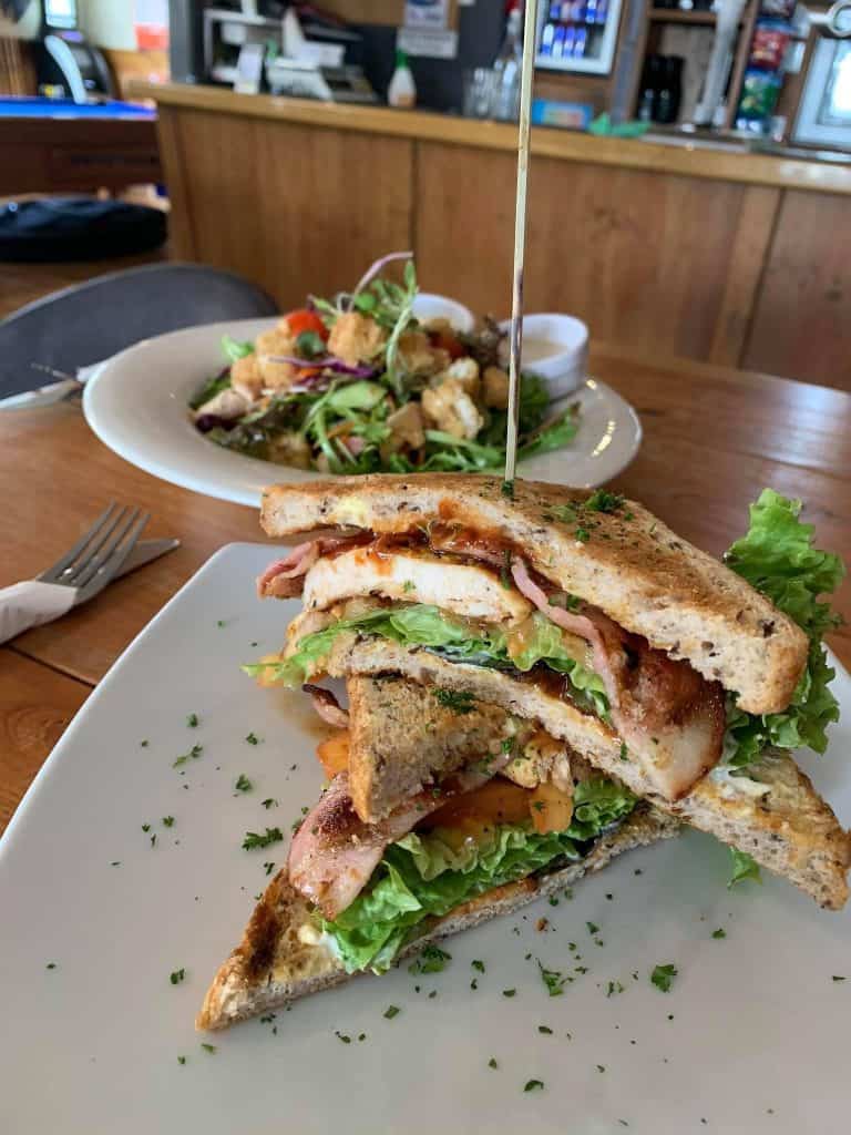 Delicious club sandwich with fresh ingredients served at Stumble Inn NZ.
