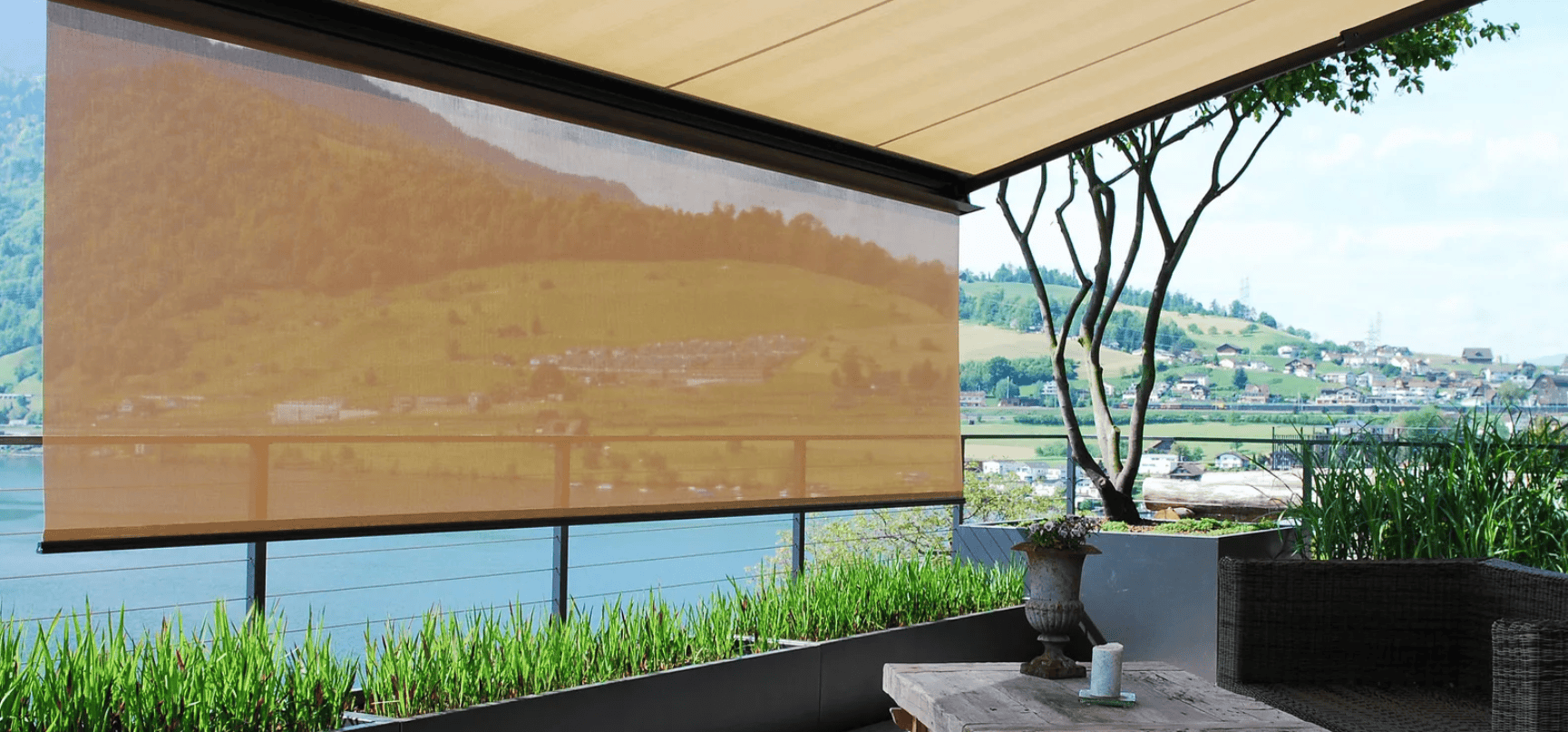 Elegant beige sun shades window fashions controlling natural light in a bright home office.