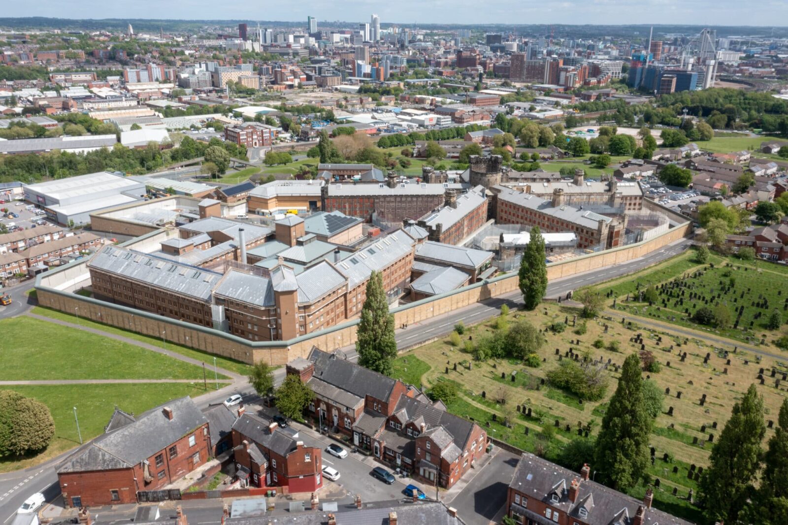 Aerial drone photo of the town of Armley in Leeds West Yorkshire in the UK, showing the famous HM Prison Leeds, or Armley Prison, showing the Jail walls from above on a sunny summers day.