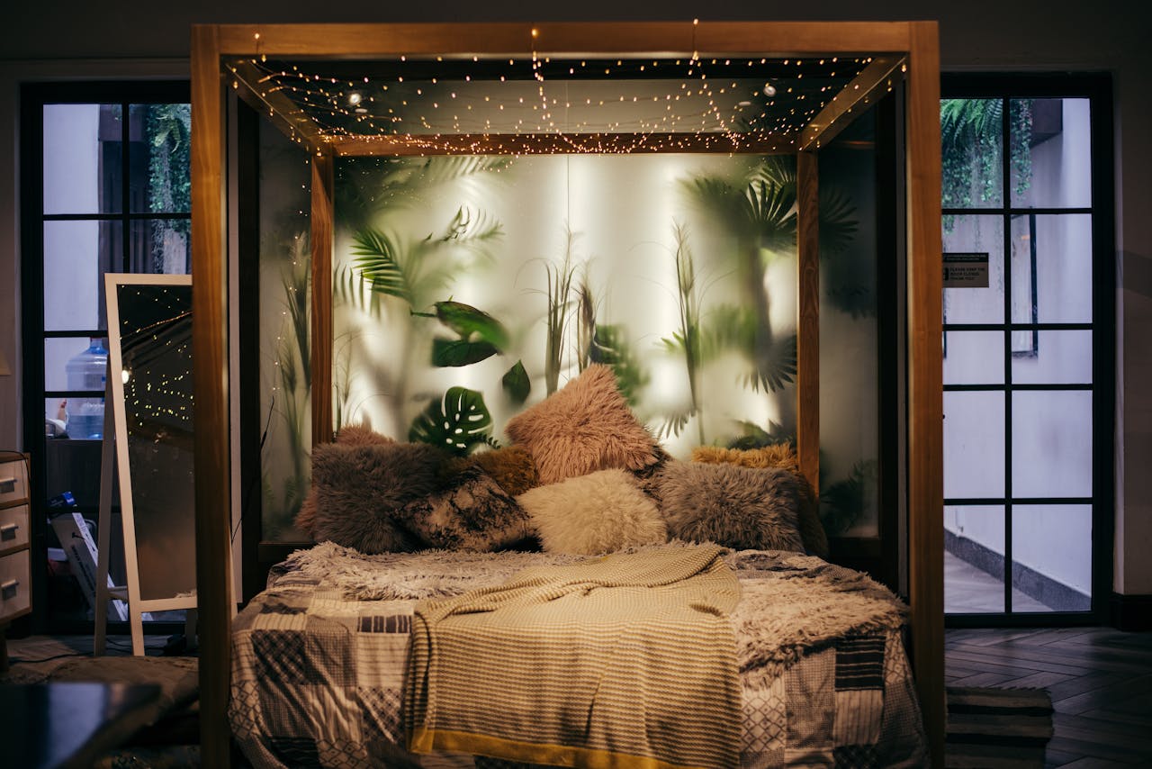 Luxurious modern bedroom with plants and string lights, creating a cozy ambiance.