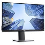 Οθόνη υπολογιστή Dell σε αστικό τοπίο μεγάλων κτιρίων, ιδανική για εργασία και διασκέδαση.