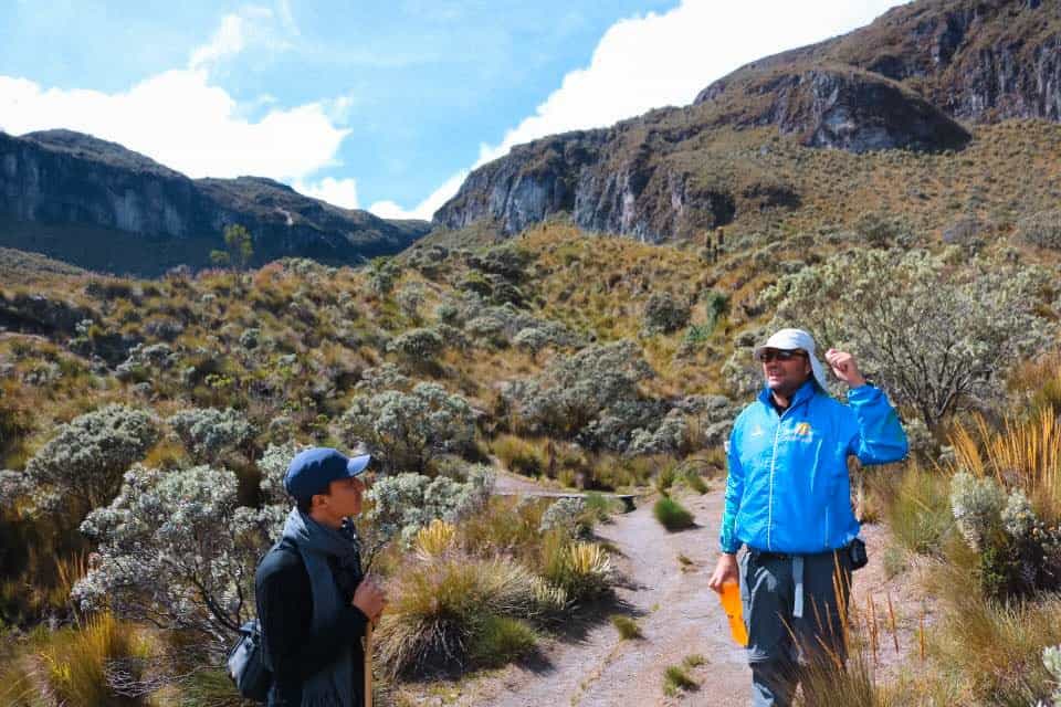 Talking with a local guide on a guided glacier hike in Los Nevados National Natural Park.