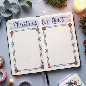 An open journal displays two decorated pages labeled christmas eve quiet, perfect for christmas eve journaling. Each page features a blank box bordered by pinecones and ornaments, surrounded by candles, greenery, and stationery items.