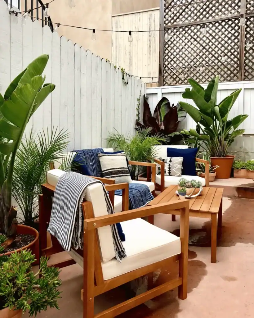 white and blue patio with wooden furniture